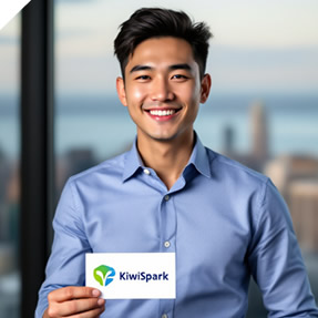 Man holding a branded business card with a smile